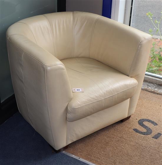 A cream leather tub chair